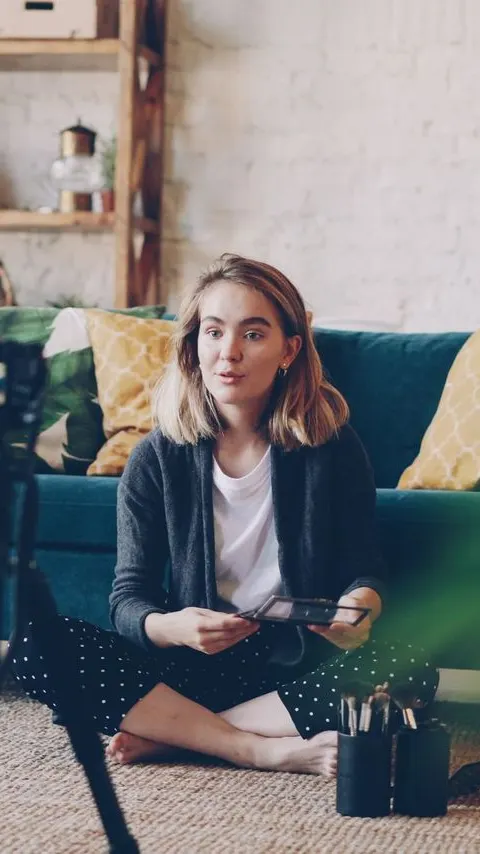Objection angle: a vertical cut of someone talking to camera from a sofa, captioned