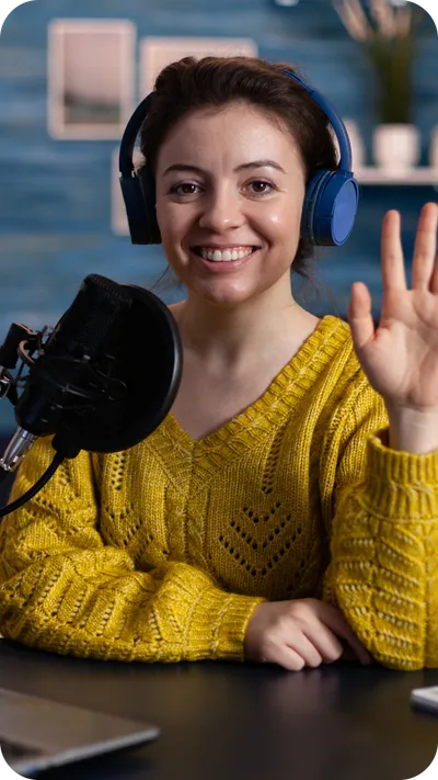 Someone answering questions on camera in a recorded interview setup